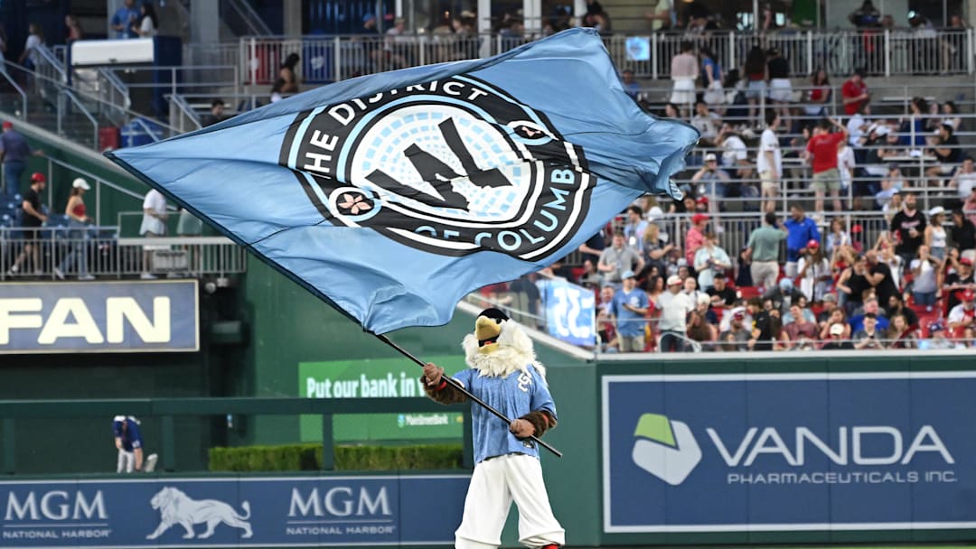 Jun 6, 2025; Washington, District of Columbia, USA; Washington Nationals mascot flies a flag in the outfield after defeating the Texas Rangers at Nationals Park.