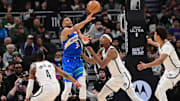 Mar 21, 2024; Milwaukee, Wisconsin, USA;  Milwaukee Bucks forward Giannis Antetokounmpo (34) gets a pass away from Brooklyn Nets center Nicolas Claxton (33) and guard Dennis Smith Jr. (4) in the fourth quarterat Fiserv Forum. Mandatory Credit: Benny Sieu-Imagn Images