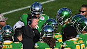 Jan 1, 2025; Pasadena, CA, USA; Oregon Ducks head coach Dan Lanning during a timeout in the first quarter against the Ohio State Buckeyes at Rose Bowl Stadium. Mandatory Credit: Robert Hanashiro-Imagn Images