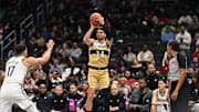 Nov 16, 2025; Washington, District of Columbia, USA;  Washington Wizards forward Corey Kispert (24) attempts a jump shot in front of Brooklyn Nets forward Michael Porter Jr. (17) during the third quarter at Capital One Arena. Mandatory Credit: Rafael Suanes-Imagn Images