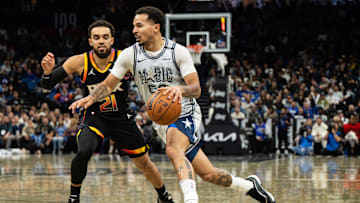 Dec 8, 2024; Orlando, Florida, USA; Orlando Magic guard Cole Anthony (50) drives to the goal against Phoenix Suns guard Tyus Jones (21) in the second quarter at Kia Center. Mandatory Credit: Jeremy Reper-Imagn Images