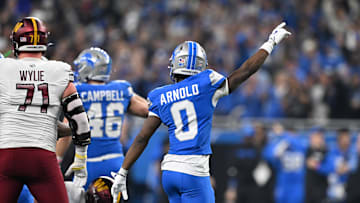 Jan 18, 2025; Detroit, Michigan, USA; Detroit Lions corner back Terrion Arnold (0) celebrates after a fourth down stop against the Washington Commanders during the first quarter in a 2025 NFC divisional round game at Ford Field. Mandatory Credit: Lon Horwedel-Imagn Images