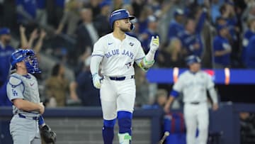 Nov 1, 2025; Toronto, Ontario, CAN; Toronto Blue Jays designated hitter Bo Bichette (11) reacts after hitting a three run home run against the Los Angeles Dodgers in the third inning during game seven of the 2025 MLB World Series at Rogers Centre. Mandatory Credit: John E. Sokolowski-Imagn Images