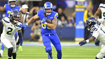 Jan 5, 2025; Inglewood, California, USA; Los Angeles Rams tight end Tyler Higbee (89) runs for a first down before he is stopped by Seattle Seahawks safety Rayshawn Jenkins (2) and linebacker Ernest Jones IV (13) in the second half at SoFi Stadium. Mandatory Credit: Jayne Kamin-Oncea-Imagn Images