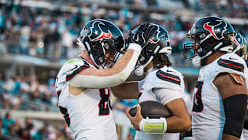 Dec 1, 2024; Jacksonville, Florida, USA; Houston Texans tight end Dalton Schultz (86) and  quarterback C.J. Stroud (7) celebrate a touchdown in the fourth quarter at EverBank Stadium. Mandatory Credit: Jeremy Reper-Imagn Images