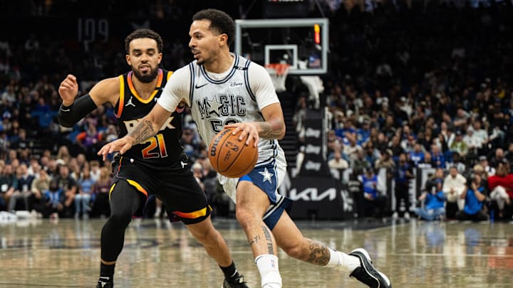 Dec 8, 2024; Orlando, Florida, USA; Orlando Magic guard Cole Anthony (50) drives to the goal against Phoenix Suns guard Tyus Jones (21) in the second quarter at Kia Center. Mandatory Credit: Jeremy Reper-Imagn Images