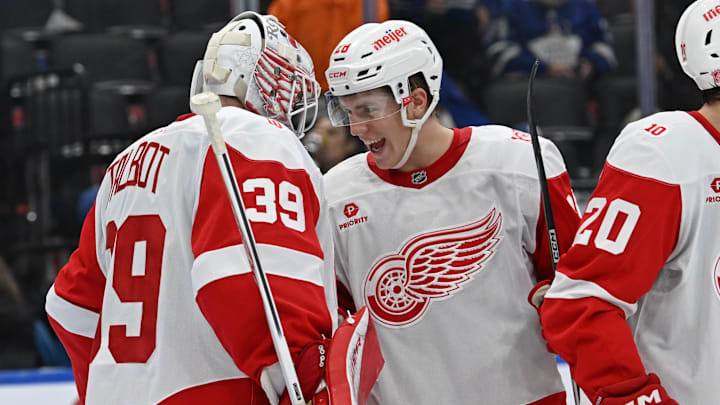 Oct 13, 2025; Toronto, Ontario, CAN; Detroit Red Wings right wing Michael Brandsegg Nygard (28) celebrates the victory over the Toronto Maple Leafs with goalie Cameron Talbot (39) at Scotiabank Arena. Mandatory Credit: Gerry Angus-Imagn Images