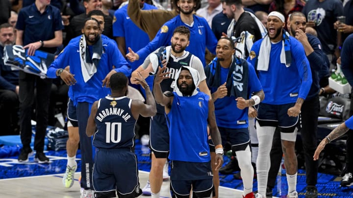 Jun 14, 2024; Dallas, Texas, USA; Dallas Mavericks forward Tim Hardaway Jr. (10) celebrates with his teammates after he makes a three point shot against the Boston Celtics during the game between the Dallas Mavericks and the Boston Celtics in game four of the 2024 NBA Finals at American Airlines Center. Mandatory Credit: Jerome Miron-USA TODAY Sports