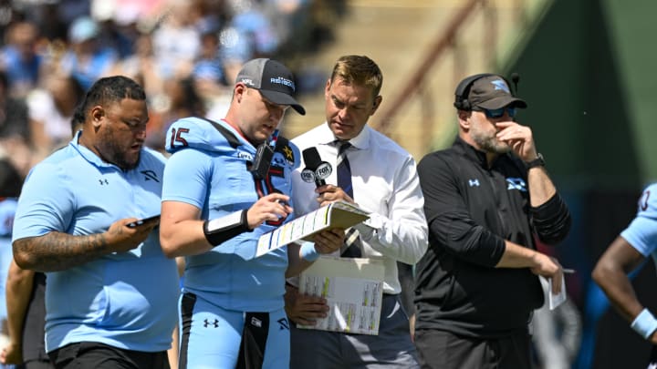 Mar 30, 2024; Arlington, TX, USA; Fox sports sideline reporter and former NFL quarterback Brock Huard talks on the sidelines with Arlington Renegades quarterback Holton Ahlers (15) during the second half of the game against the Birmingham Stallions at Choctaw Stadium. Mandatory Credit: Jerome Miron-USA TODAY Sports