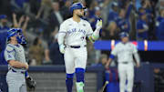Nov 1, 2025; Toronto, Ontario, CAN; Toronto Blue Jays designated hitter Bo Bichette (11) reacts after hitting a three run home run against the Los Angeles Dodgers in the third inning during game seven of the 2025 MLB World Series at Rogers Centre. Mandatory Credit: John E. Sokolowski-Imagn Images