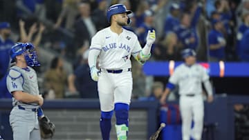 Nov 1, 2025; Toronto, Ontario, CAN; Toronto Blue Jays designated hitter Bo Bichette (11) reacts after hitting a three run home run against the Los Angeles Dodgers in the third inning during game seven of the 2025 MLB World Series at Rogers Centre. Mandatory Credit: John E. Sokolowski-Imagn Images