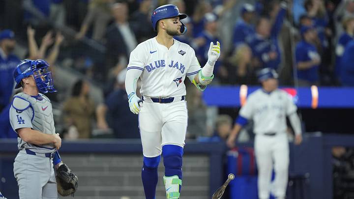 Nov 1, 2025; Toronto, Ontario, CAN; Toronto Blue Jays designated hitter Bo Bichette (11) reacts after hitting a three run home run against the Los Angeles Dodgers in the third inning during game seven of the 2025 MLB World Series at Rogers Centre. Mandatory Credit: John E. Sokolowski-Imagn Images
