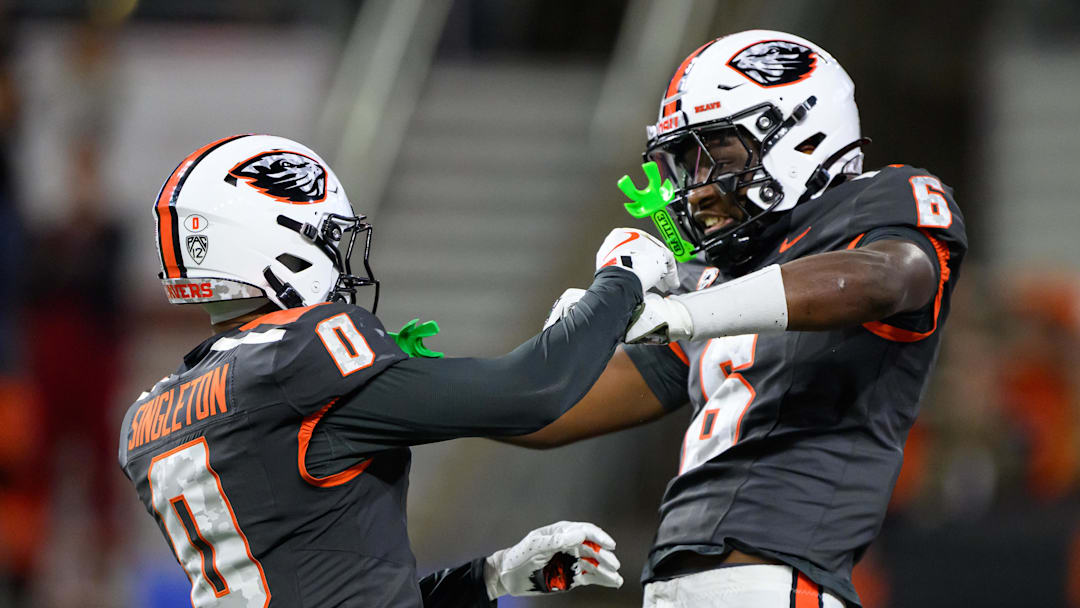 Nov 1, 2025; Corvallis, Oregon, USA; Oregon State Beavers running back Anthony Hankerson (0) and quarterback Maalik Murphy (6) celebrate a defensive stop against the Washington State Cougars during the second half at Reser Stadium. Mandatory Credit: Craig Strobeck-Imagn Images