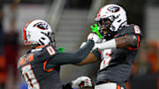 Nov 1, 2025; Corvallis, Oregon, USA; Oregon State Beavers running back Anthony Hankerson (0) and quarterback Maalik Murphy (6) celebrate a defensive stop against the Washington State Cougars during the second half at Reser Stadium. Mandatory Credit: Craig Strobeck-Imagn Images