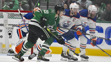May 25, 2024; Dallas, Texas, USA; Dallas Stars left wing Jason Robertson (21) and Edmonton Oilers center Connor McDavid (97) look for the puck in the Oilers zone during the third period in game two of the Western Conference Final of the 2024 Stanley Cup Playoffs at American Airlines Center. Mandatory Credit: Jerome Miron-USA TODAY Sports