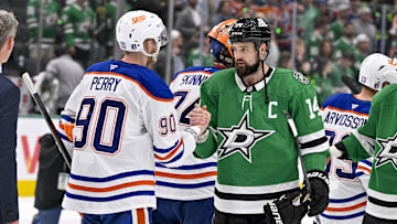 May 29, 2025; Dallas, Texas, USA; Edmonton Oilers right wing Corey Perry (90) and Dallas Stars left wing Jamie Benn (14) shake hands after the game between the Dallas Stars and the Edmonton Oilers in game five of the Western Conference Final of the 2025 Stanley Cup Playoffs at American Airlines Center. Mandatory Credit: Jerome Miron-Imagn Images