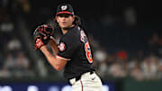 Aug 28, 2024; Washington, District of Columbia, USA; Washington Nationals relief pitcher Kyle Finnegan (67) prepares to throw a pitch against the New York Yankees during the ninth inning at Nationals Park. Mandatory Credit: Rafael Suanes-Imagn Images