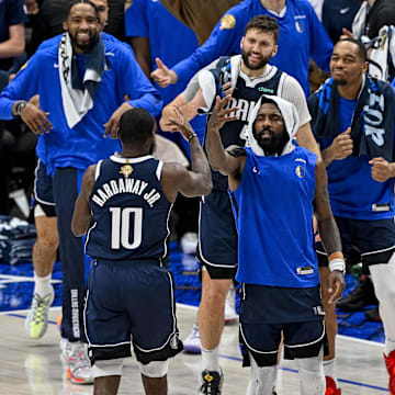Jun 14, 2024; Dallas, Texas, USA; Dallas Mavericks forward Tim Hardaway Jr. (10) celebrates with his teammates after he makes a three point shot against the Boston Celtics during the game between the Dallas Mavericks and the Boston Celtics in game four of the 2024 NBA Finals at American Airlines Center. Mandatory Credit: Jerome Miron-Imagn Images