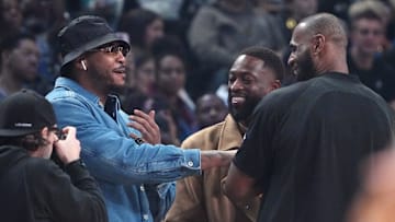 NBA stars Carmelo Anthony, Dwyane Wade and LeBron James greet each other before the 2023 NBA All-Star Game at Vivint Arena
