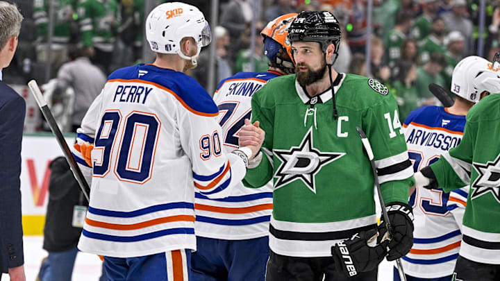 May 29, 2025; Dallas, Texas, USA; Edmonton Oilers right wing Corey Perry (90) and Dallas Stars left wing Jamie Benn (14) shake hands after the game between the Dallas Stars and the Edmonton Oilers in game five of the Western Conference Final of the 2025 Stanley Cup Playoffs at American Airlines Center. Mandatory Credit: Jerome Miron-Imagn Images