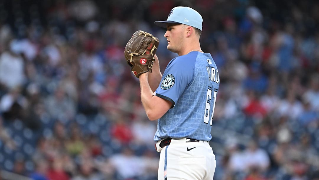 Jun 6, 2025; Washington, District of Columbia, USA; Washington Nationals relief pitcher Brad Lord (61) prepares to throw a pitch during the seventh inning against the Texas Rangers at Nationals Park. Mandatory Credit: Rafael Suanes-Imagn Images