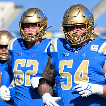 Nov 30, 2024; Pasadena, California, USA; UCLA Bruins offensive lineman Michael Sultemeier (62), Josh Carlin (54) and Jensen Somerville (60) during pregame warmups before playing Fresno State Bulldogs at Rose Bowl. Mandatory Credit: Robert Hanashiro-Imagn Images