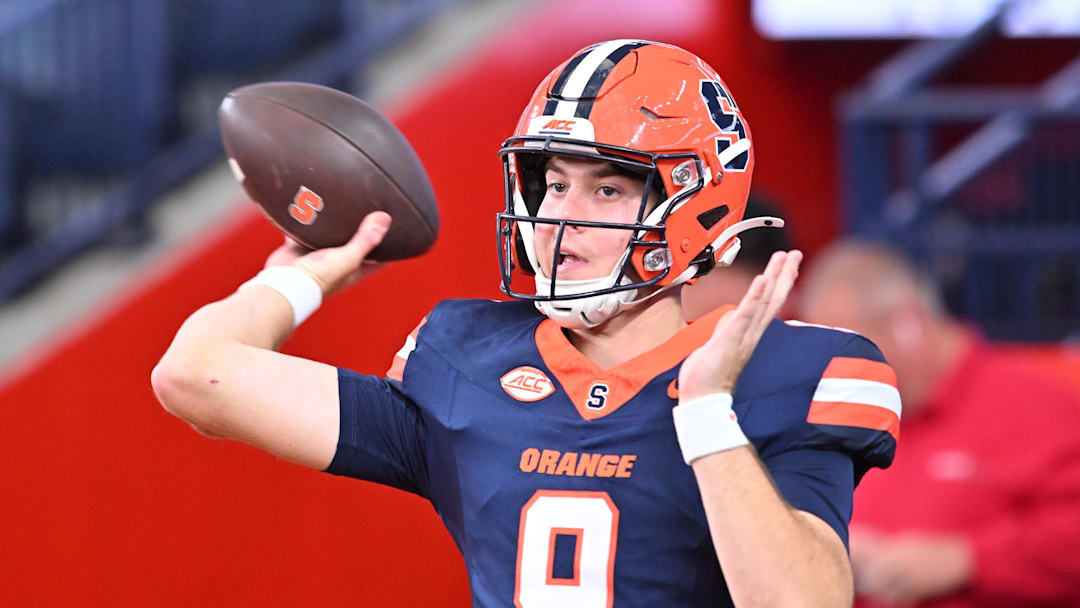 Sep 12, 2025; Syracuse, New York, USA; Syracuse Orange quarterback Steve Angeli (9) warms up before a game against the Colgate Raiders at JMA Wireless Dome. Mandatory Credit: Mark Konezny-Imagn Images