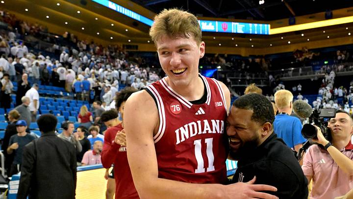 Jan 31, 2026; Los Angeles, California, USA;  Indiana Hoosiers forward Trent Sisley (11) celebrates with assistand coach Rod Clark after defeating the UCLA Bruins in double overtime at Pauley Pavilion presented by Wescom Financial. Mandatory Credit: Jayne Kamin-Oncea-Imagn Images