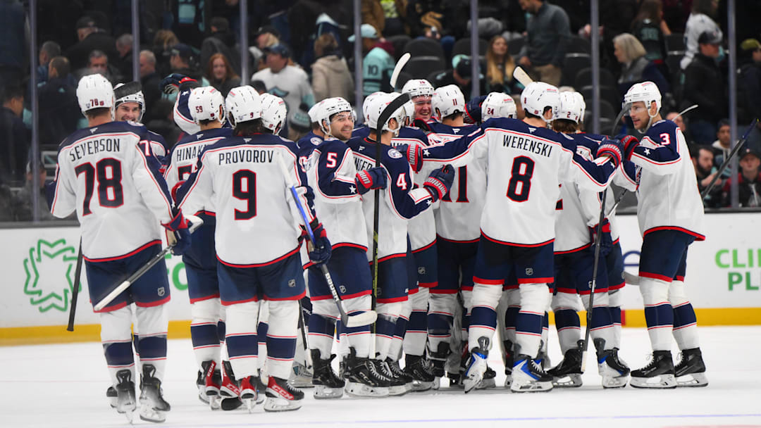 The Columbus Blue Jackets celebrate after defeating the Seattle Kraken during a shootout at Climate Pledge Arena