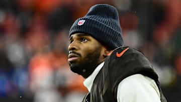 Dec 7, 2025; Cleveland, Ohio, USA; Cleveland Browns quarterback Shedeur Sanders (12) watches from the sidelines late in the fourth quarter against the Tennessee Titans at Huntington Bank Field. Mandatory Credit: Ken Blaze-Imagn Images