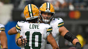 Oct 6, 2024; Inglewood, California, USA; Green Bay Packers quarterback Jordan Love (10) hugs center Josh Myers (71) before an NFL game against the Los Angeles Rams at SoFi Stadium. Mandatory Credit: Robert Hanashiro-Imagn Images