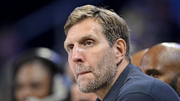 Former NBA player Dirk Nowitzki watches the game between the Dallas Wings and the Seattle Storm.