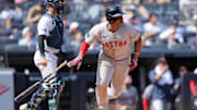 Sep 14, 2024; Bronx, New York, USA; Boston Red Sox third baseman Rafael Devers (11) follows through on a two run single against the New York Yankees during the fifth inning at Yankee Stadium. Mandatory Credit: Brad Penner-Imagn Images