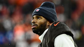 Dec 7, 2025; Cleveland, Ohio, USA; Cleveland Browns quarterback Shedeur Sanders (12) watches from the sidelines late in the fourth quarter against the Tennessee Titans at Huntington Bank Field. Mandatory Credit: Ken Blaze-Imagn Images