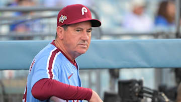 Oct 8, 2025; Los Angeles, California, USA; Philadelphia Phillies manager Rob Thomson (49) looks on before the game against the Los Angeles Dodgers during game three of the NLDS round for the 2025 MLB playoffs at Dodger Stadium.