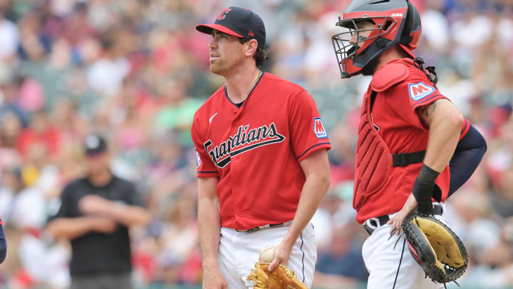 Jul 9, 2023; Cleveland, Ohio, USA; Cleveland Guardians starting pitcher Shane Bieber (57) and catcher Cam Gallagher (35) look to the scoreboard during the sixth inning against the Kansas City Royals at Progressive Field. Mandatory Credit: Ken Blaze-USA TODAY Sports