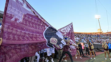Sep 28, 2024; Dallas, Texas, USA; Florida State Seminoles head coach Mike Norvell leads his team on to the field to face the Southern Methodist Mustangs at Gerald J. Ford Stadium. Mandatory Credit: Jerome Miron-Imagn Images