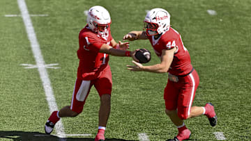 Oct 18, 2025; Houston, Texas, USA; Houston Cougars quarterback Conner Weigman (1) hands off the ball to running back Dean Connors (44) during the first quarter against the Arizona Wildcats at TDECU Stadium. Mandatory Credit: Maria Lysaker-Imagn Images 