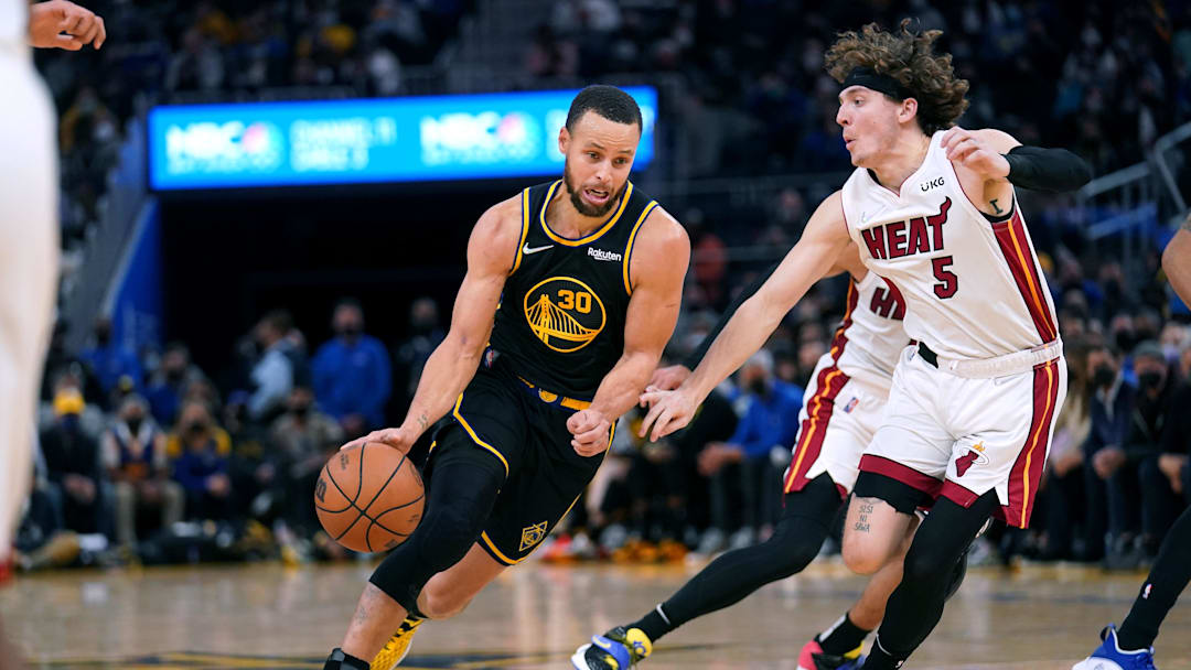 Jan 3, 2022; San Francisco, California, USA; Golden State Warriors guard Stephen Curry (30) dribbles past Miami Heat guard Kyle Guy (5) in the fourth quarter at the Chase Center. Mandatory Credit: Cary Edmondson-Imagn Images Jan 3, 2022; San Francisco, California, USA; Golden State Warriors guard Stephen Curry (30) dribbles past Miami Heat guard Kyle Guy (5) in the fourth quarter at the Chase Center. Mandatory Credit: Cary Edmondson-Imagn Images