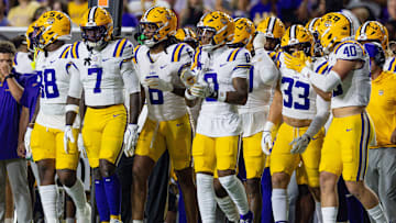 Oct 11, 2025; Baton Rouge, Louisiana, USA;  LSU Tigers linebacker Harold Perkins Jr. (7), linebacker Whit Weeks (40) and linebacker West Weeks (33) walk on the field against the South Carolina Gamecocks during the first half at Tiger Stadium. Mandatory Credit: Stephen Lew-Imagn Images