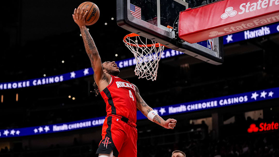 Houston Rockets guard JD Davison (4) shoots at the basket against the Atlanta Hawks during the second half at State Farm Arena.
