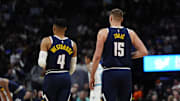 Feb 20, 2025; Denver, Colorado, USA; Denver Nuggets guard Russell Westbrook (4) and center Nikola Jokic (15) during the first quarter against the Charlotte Hornets at Ball Arena. Mandatory Credit: Ron Chenoy-Imagn Images
