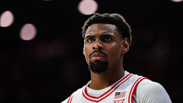 Feb 26, 2025; Tucson, Arizona, USA; Arizona Wildcats guard KJ Lewis (5) watches the game intensely from the bench during the second half against the Utah Utes at McKale Center. Mandatory Credit: Aryanna Frank-Imagn Images