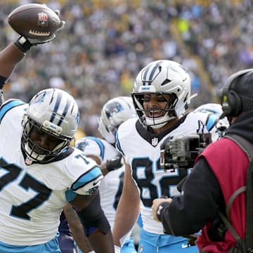 Nov 2, 2025; Green Bay, Wisconsin, USA; Carolina Panthers offensive tackle Yosh Nijman (77) celebrates after a Panthers touchdown during the first half against the Green Bay Packers at Lambeau Field. Mandatory Credit: Jeff Hanisch-Imagn Images