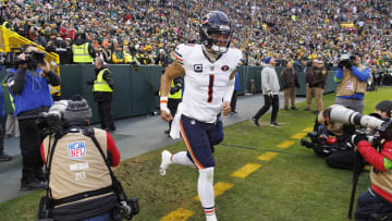 Jan 7, 2024; Green Bay, Wisconsin, USA;  Chicago Bears quarterback Justin Fields (1) runs onto the field prior to the game against the Green Bay Packers at Lambeau Field. Mandatory Credit: Jeff Hanisch-USA TODAY Sports