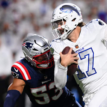 Oct 5, 2025; Orchard Park, New York, USA; Buffalo Bills quarterback Josh Allen (17) rushes the ball past New England Patriots linebacker Christian Elliss (53)