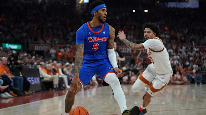 Feb 25, 2026; Austin, Texas, USA; Florida Gators guard Boogie Fland (0) dribbles against Texas Longhorns guard Jordan Pope (0) during the second half at Moody Center. Mandatory Credit: Dustin Safranek-Imagn Images