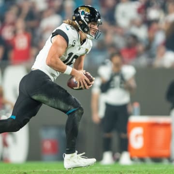 Dec 24, 2023; Tampa, Florida, USA; Jacksonville Jaguars quarterback Trevor Lawrence (16) runs the ball against the Tampa Bay Buccaneers in the third quarter at Raymond James Stadium. Mandatory Credit: Jeremy Reper-USA TODAY Sports