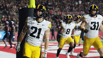 Sep 19, 2025; Piscataway, New Jersey, USA; Iowa Hawkeyes wide receiver Kaden Wetjen (21) celebrates with teammates after returning the opening kickoff for a touchdown during the first quarter against the Rutgers Scarlet Knights at SHI Stadium. Mandatory Credit: Vincent Carchietta-Imagn Images