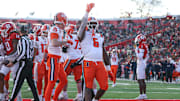 Nov 23, 2024; Piscataway, New Jersey, USA; Illinois Fighting Illini running back Josh McCray (6) celebrates his touchdown during the second half against the Rutgers Scarlet Knights at SHI Stadium. Mandatory Credit: Vincent Carchietta-Imagn Images